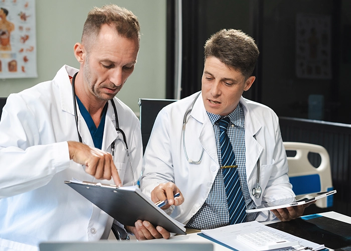 Doctors reviewing patient data