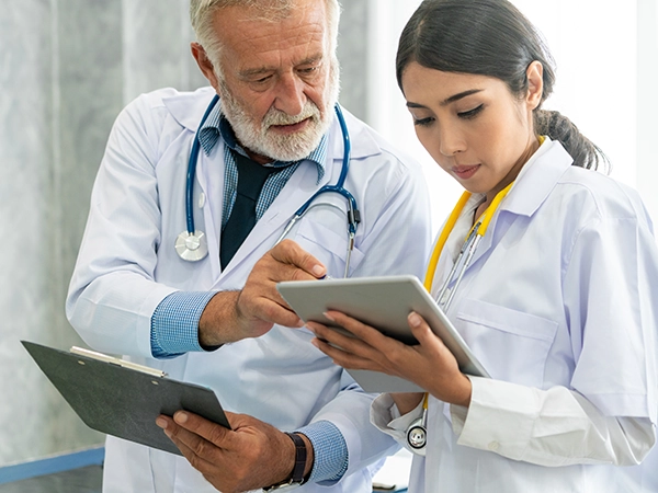 Doctors reviewing patient data